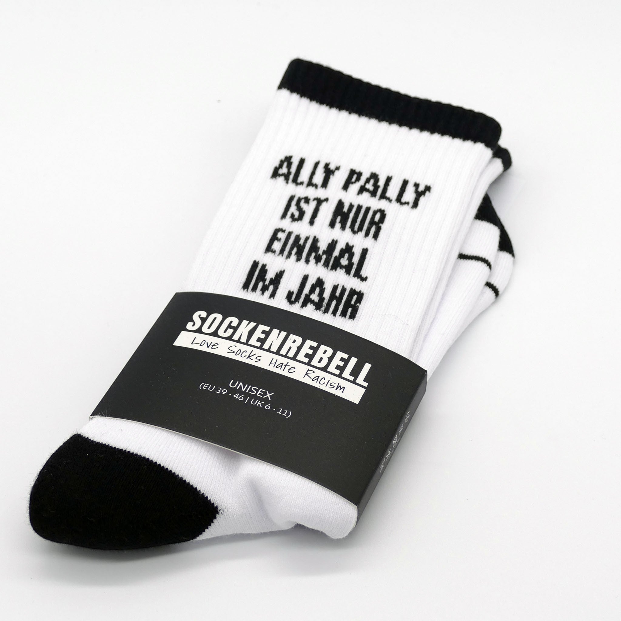 SOCKENREBELL black and white socks with "ALLY PALLY IST NUR EINMAL IM JAHR" text. Cotton blend.
