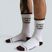 SOCKENREBELL white and brown crew socks with "PYROTECHNIK IST DOCH KEIN VERBRECHEN" text. Cotton blend.