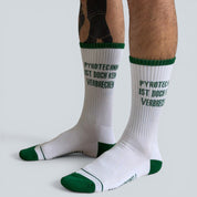 SOCKENREBELL white crew socks with green trim and text "Pyrotechnik ist doch kein Verbrechen"