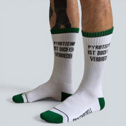 SOCKENREBELL white crew socks with green trim and black text "PYROTECHNIK IST DOCH KEIN VERBRECHEN".